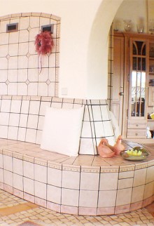 This tiled fireplace heats up three rooms at the same time