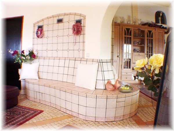 This tiled fireplace heats up three rooms at the same time